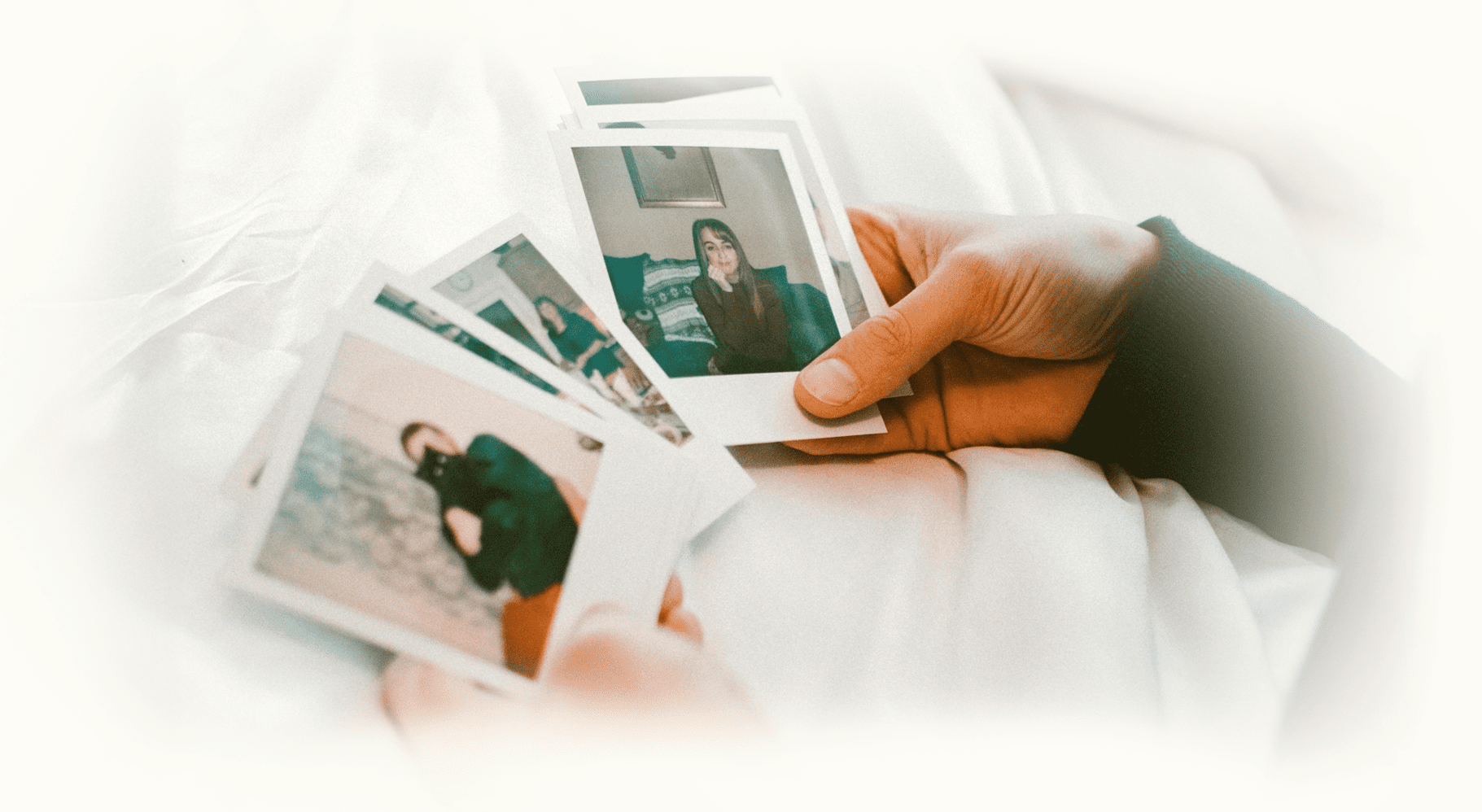 Hands holding Polaroids